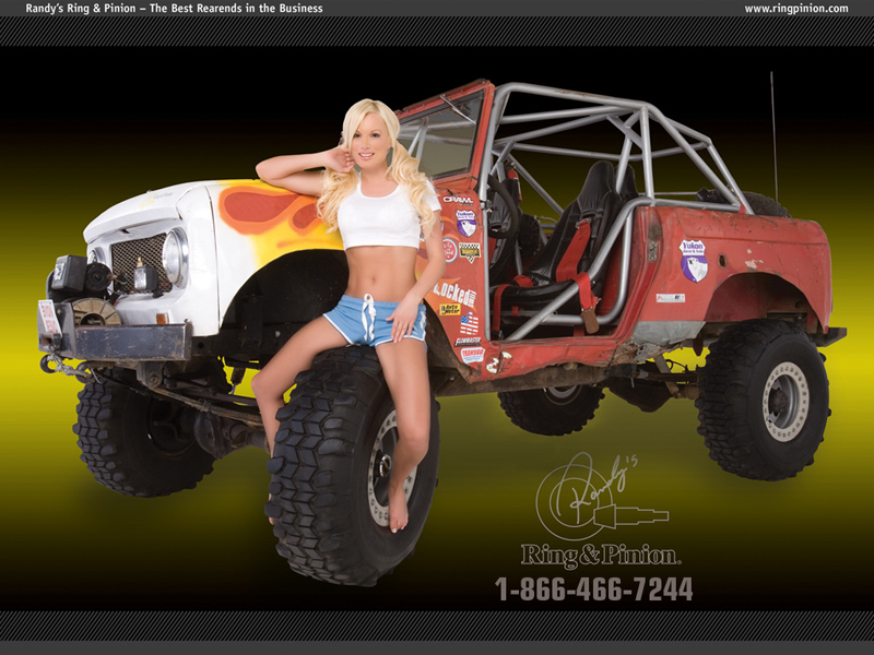 Red caged Ford Bronco rock crawler with flamed hood and mud tires in a Ring and Pinion ad