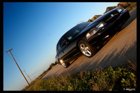 2003 Mercury Marauder - A black 2003 Mercury Marauder is viewed from a low angle on a sunny day.