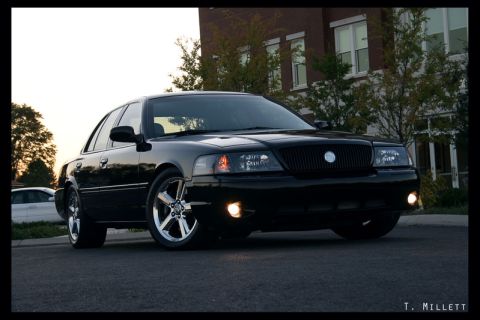 2003 Mercury Marauder - A black 2003 Mercury Marauder is shown from a 3q-front angle, parked on a street.