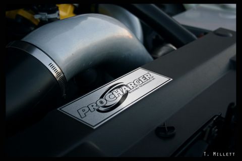 2003 Mercury Marauder - Close-up of a ProCharger supercharger intake pipe and associated components.