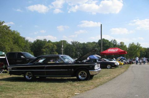 2003 Mercury Marauder - Classic black Ford Galaxie coupe on display at an outdoor car show event.