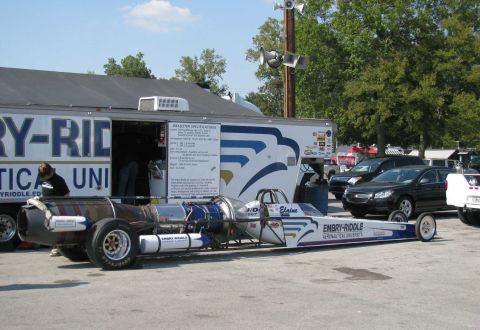 2003 Mercury Marauder - A jet-powered dragster with 'Embry-Riddle Aeronautical University' branding is parked outdoors.