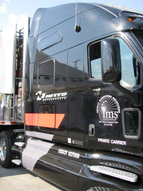 2003 Mercury Marauder - This truck has 'T2000' and 'USDOT 627569' visible on its side.