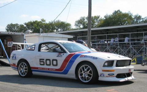 2003 Mercury Marauder - This white Ford Mustang race car displays racing decals and the number 500 on its side.