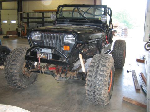 1992 Ford Mustang - This modified Jeep Wrangler features oversized tires and a front winch, suggesting off-road use.