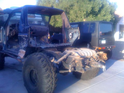 1994 Ford Bronco - This vehicle is missing its body panels and appears to be undergoing extensive modification or repair.
