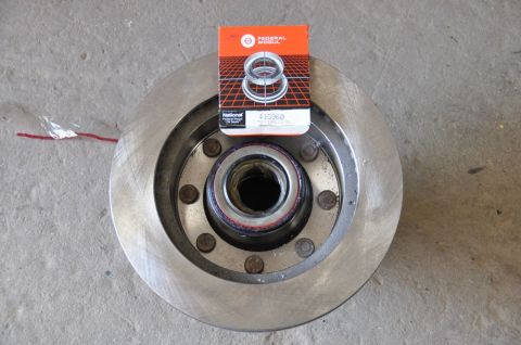 1996 Ford Bronco - Close-up of a brake rotor and a National wheel bearing kit box.