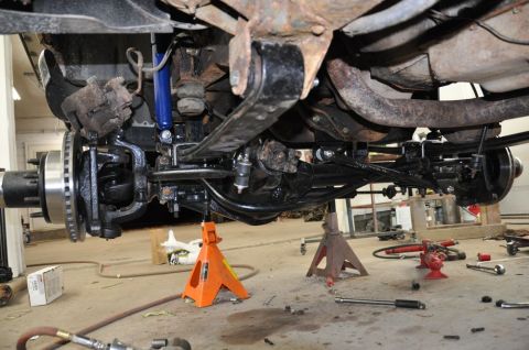 1996 Ford Bronco - Close-up view of the undercarriage of a 1996 Ford Bronco, highlighting the suspension and brake components.