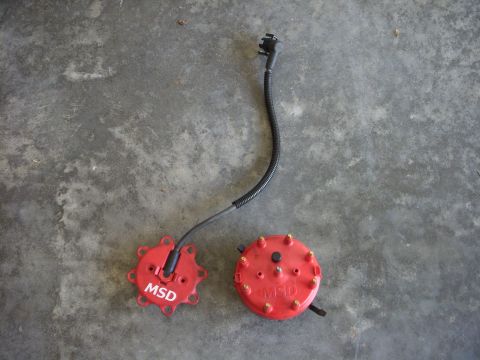 1993 Ford Bronco - MSD distributor caps and rotor shown on a concrete floor.