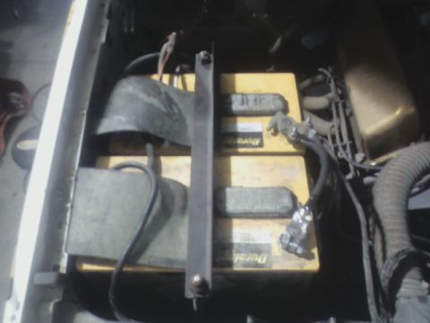 1992 Ford F-350 - The engine bay shows two Duralast batteries secured by a metal bracket and connected by wiring.