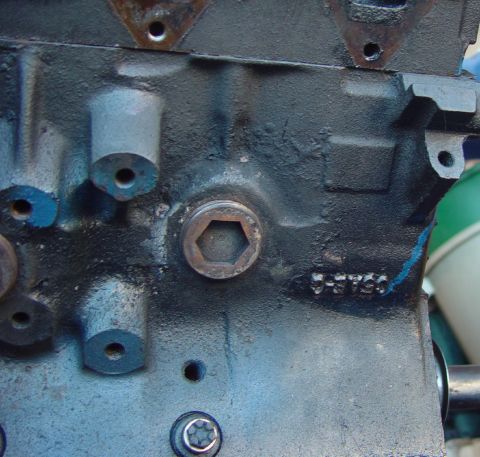 1969 Ford Fairlane - Engine block detail showing a hexagonal plug and stamped casting numbers.