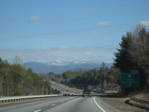 2001 Ford Crown Victoria - Driving on a highway with a view of distant mountains and trees.