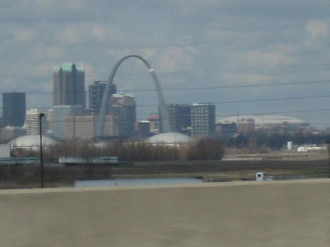 2001 Ford Crown Victoria - View of the Gateway Arch and St. Louis skyline under a cloudy sky.
