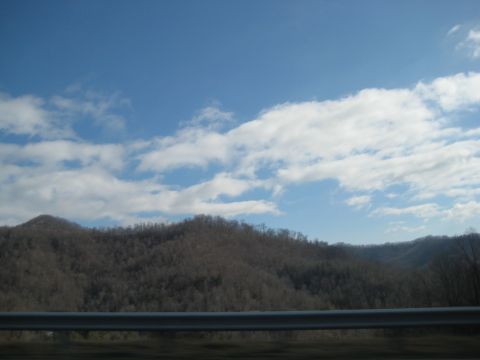2001 Ford Crown Victoria - A scenic view of mountains and sky, possibly taken from a moving vehicle.