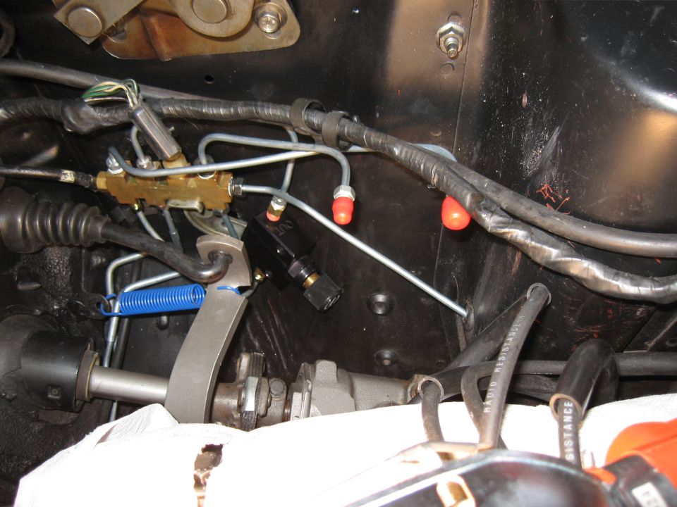 Brake proportioning valve with metal lines and a blue spring