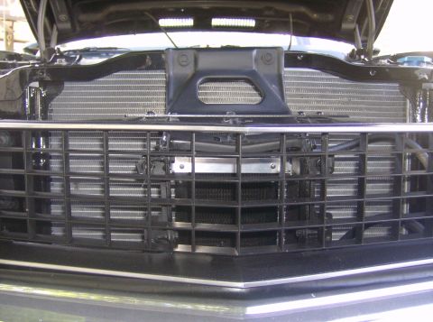 1970 Ford Ranchero - Front view of a 1970 Ford Ranchero's grille and radiator, showing the vehicle's front-end components.