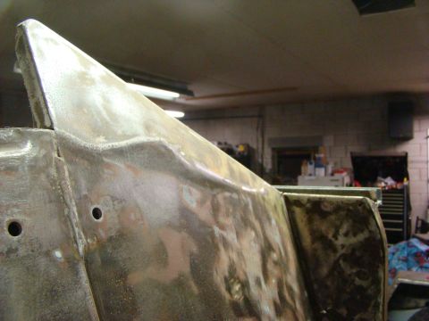 1948 Jeep Wrangler - This image shows a close-up of a bare metal vehicle body panel, likely in a workshop setting.