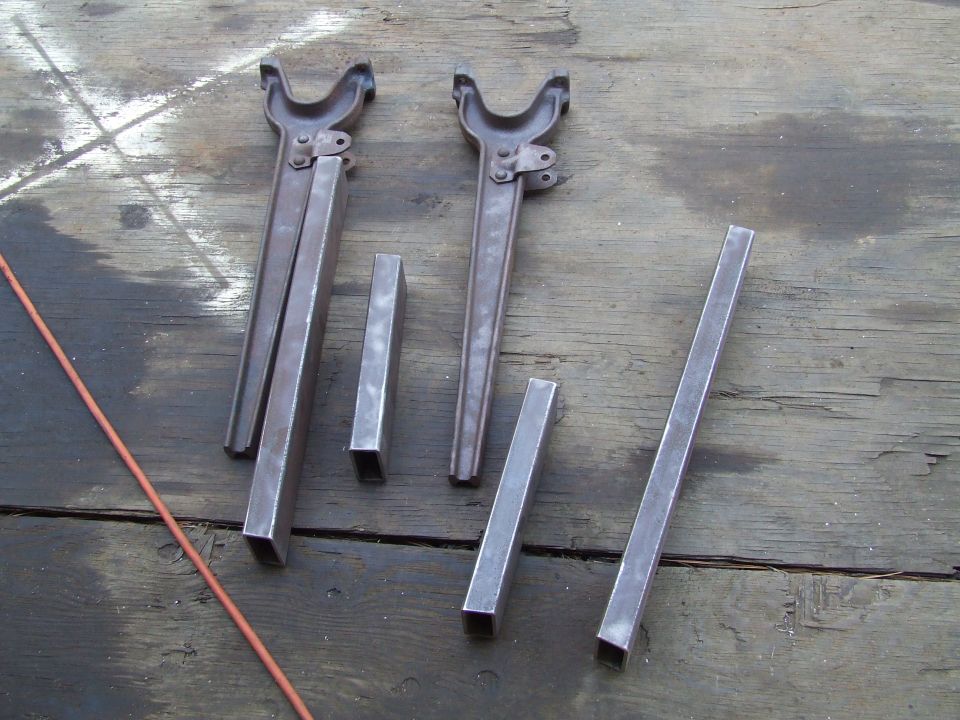 Metal parts laid out on a wooden surface