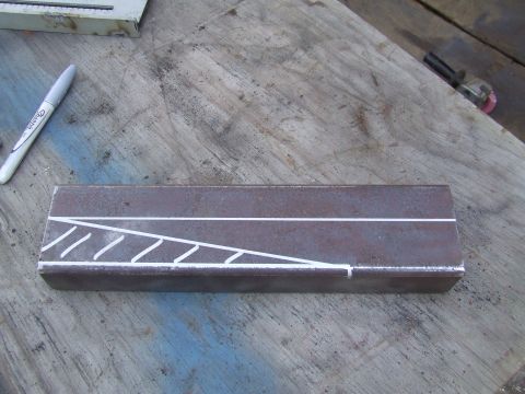 1967 Ford Bronco - A metal bar is marked with chalk lines, with a Sharpie marker nearby on a workbench.