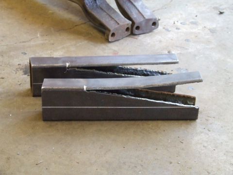 1967 Ford Bronco - Metal parts that have been cut and welded, with additional components in the background.