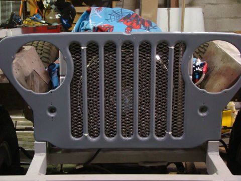 1948 Jeep Wrangler - The iconic seven-slot grille of a vintage Jeep is shown, ready for restoration or modification.