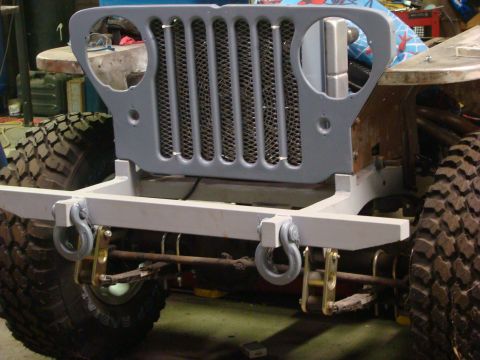 1948 Jeep Wrangler - Front end assembly of a Jeep CJ, likely undergoing restoration or modification.