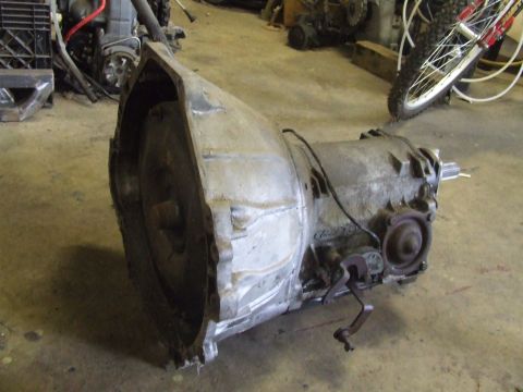 1967 Ford Bronco - An automatic transmission is shown in a workshop setting.