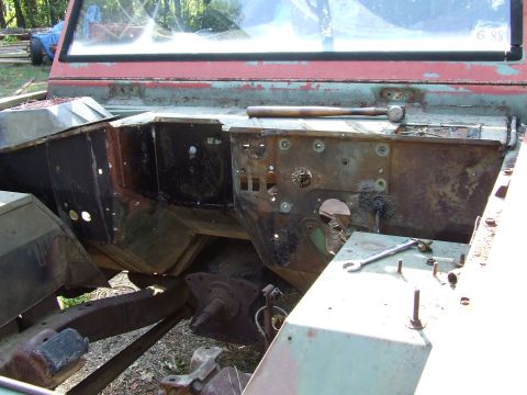 1967 Ford Bronco - Vehicle firewall and engine bay components showing significant rust and disrepair during a restoration project.