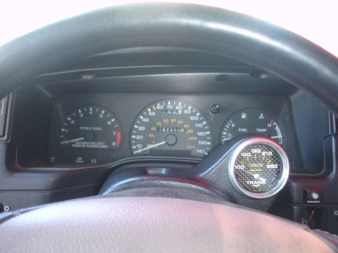1993 Ford Taurus - Interior view of a 1993 Ford Taurus dashboard with multiple gauges and steering wheel.
