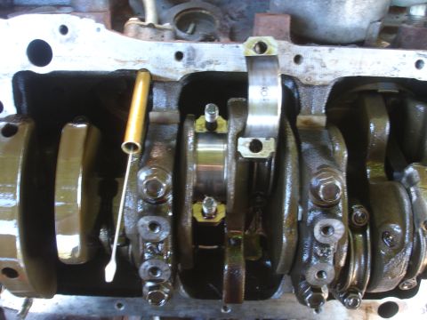 1993 Ford Taurus - Close-up view of an engine's internal components, including the crankshaft and connecting rods.
