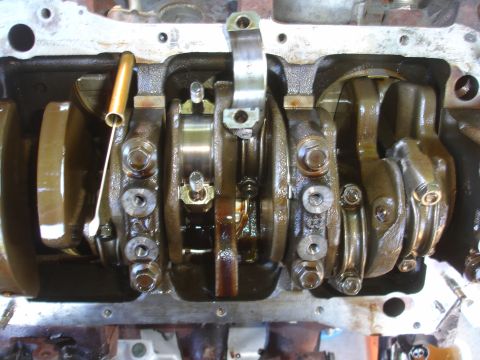 1993 Ford Taurus - The internal components of an engine, including the crankshaft and connecting rods, are shown in this detailed view.