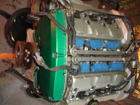 1993 Ford Taurus - V6 engine with green cover and silver valve covers, blue taped injectors.