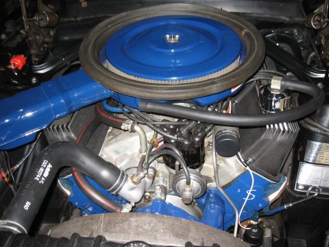 1968 Shelby GT500 - Close-up view of an engine compartment, showing various parts and blue detailing.