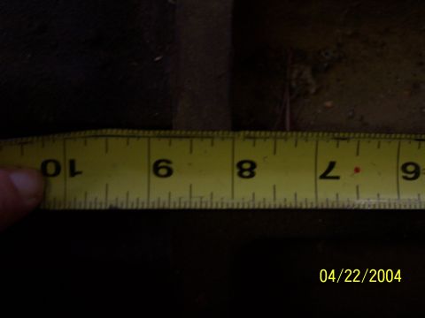 1979 Ford F-150 - A yellow measuring tape is shown with markings for inches, indicating a measurement is being taken.