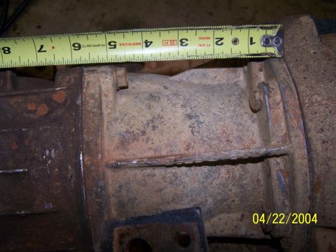 1979 Ford F-150 - Close-up of a rusty metal part, measured with a tape measure.
