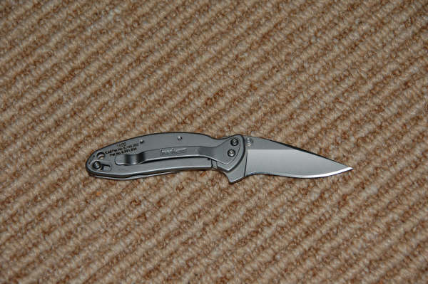 Kershaw folding knife with clip, text reads 1650, C:\KERSHAW\1650.TXT, Pat. No. 4,501,544