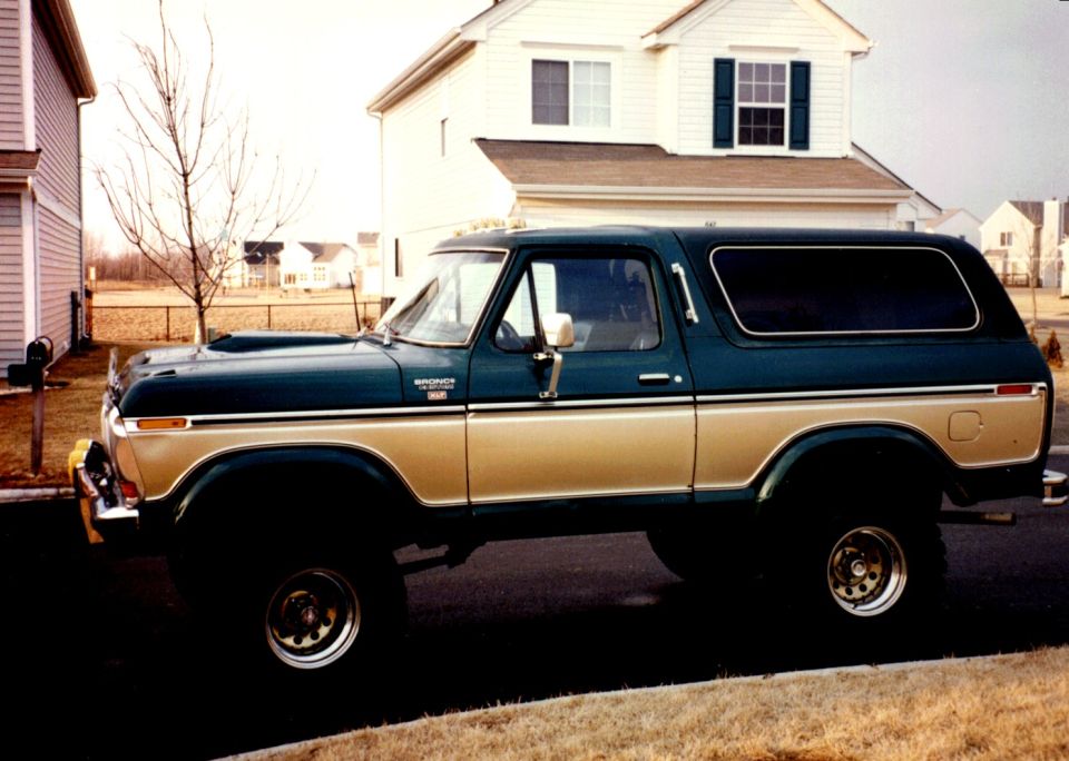 1979 Ford Bronco parked on street, side view, two-tone paint