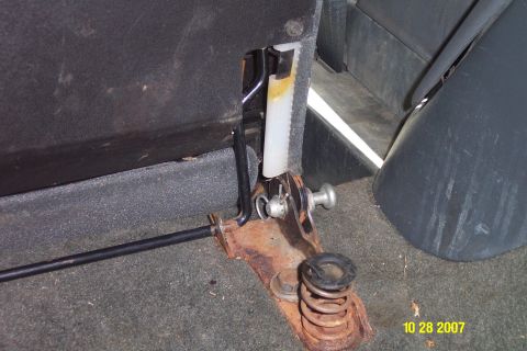 1992 Ford Bronco - The interior shows a worn seat adjustment mechanism with visible rust and a spring.