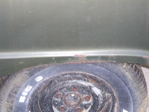 1976 Ford Bronco - Close-up of the rear fender and spare tire on a 1976 Ford Bronco.