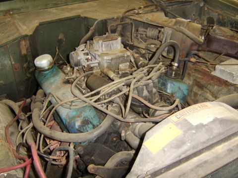 1976 Ford Bronco - Close-up view of a vehicle's engine compartment, showing various engine components and wiring.