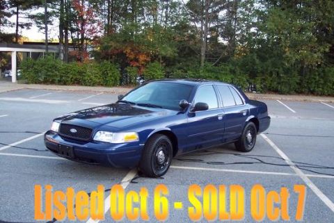 2001 Ford Crown Victoria - 2001 Ford Crown Victoria sedan parked outdoors in a parking lot.