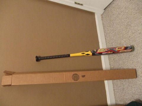 1987 Ford Bronco - A baseball bat and its packaging are shown on the floor.