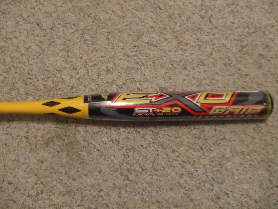Yellow and black baseball bat with red and silver graphics, labeled 'EXO GRID ST+20 BLACK ALLOY'
