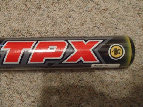 1987 Ford Bronco - A baseball bat with a prominent red TPX logo and a 10oz weight indicator is shown.
