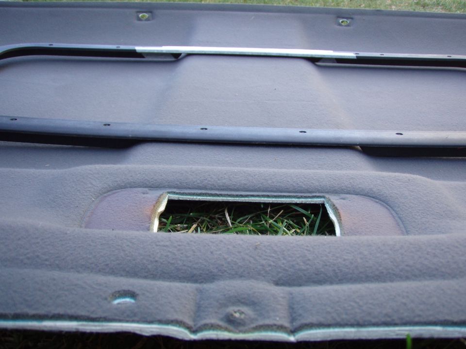 I had to cut out two angled parts of the front and back plastic ring insert, to match the contours of the interior roof and headliner.
it took me a while to cut, because the plastic was thick and it was an odd shape to grip and hold. and if you go to fast it melts on you!

i taped around the plastic so that when i cut it,... I wouldnt ruin the finnish accidentially.