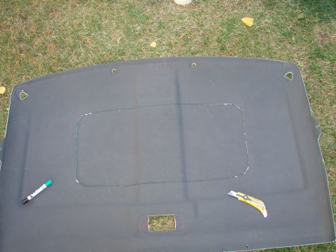 1992 Ford Bronco - after measure it 99 times i centered the plastic insert ring and taped it down, then drew a line with a felt marker NEATLY. i cut the hole…