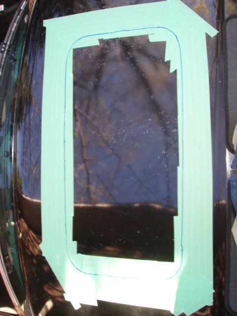 1992 Ford Bronco - i taped lots around the cutting area, so that i wouldnt scrape the paint with the jigsaw. time to insert the blade into the top drilled hol…