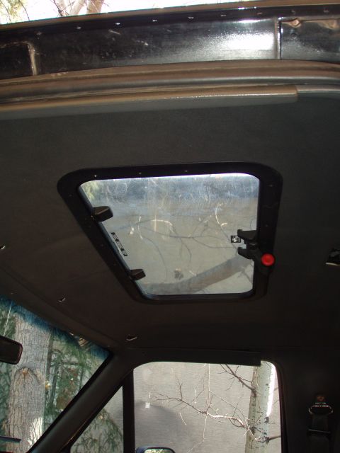 1992 Ford Bronco - after applying liberous amounts of clear silicone caulking around the sunroof and the insert ring, i screwed the two pieces together. screw…