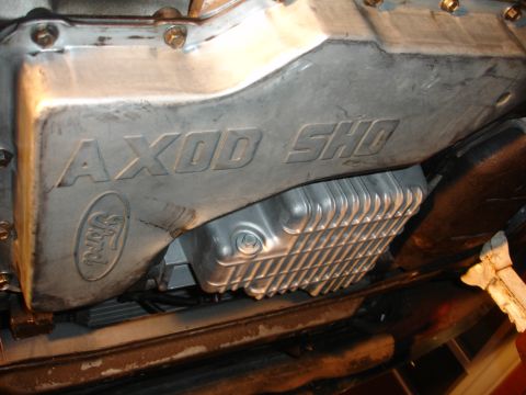 1993 Ford Taurus - Close-up of a Ford AXOD SHO transmission pan, confirming the 1993 model year.