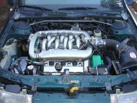 1993 Ford Taurus - Engine bay view of a Ford SHO 3.0L V6 engine, likely from a 1993 model.
